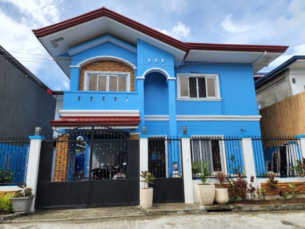 20220721_093644 Stunning two-storey house in Maribago, LapuLapu City, with blue exterior, swimming pool, and modern amenities, for sale.
