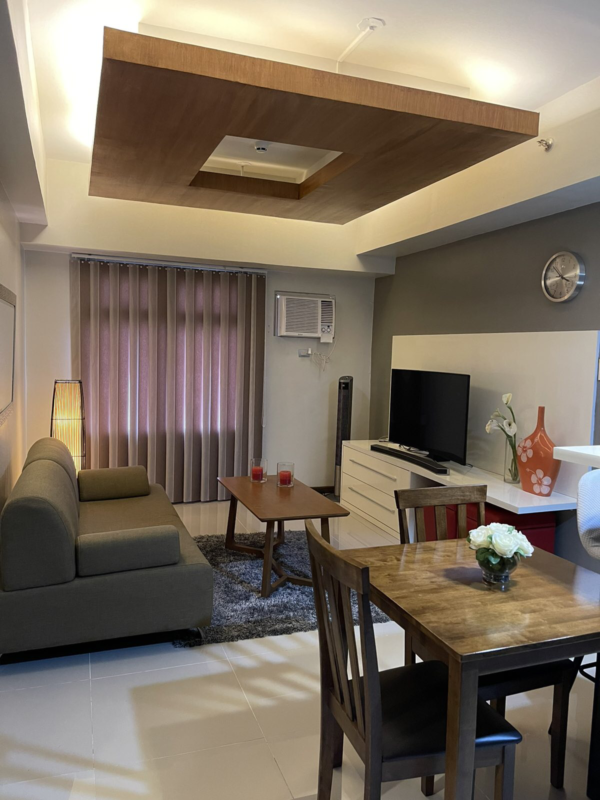 Elegant 2-bedroom condo for sale at Azalea Place, Lahug, featuring chic interiors and tandem parking, amidst Cebu City's prime location.