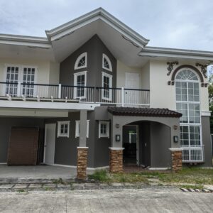 Elegant 2-storey home at Royal Palms Panglao Tres with spacious balcony and serene views.